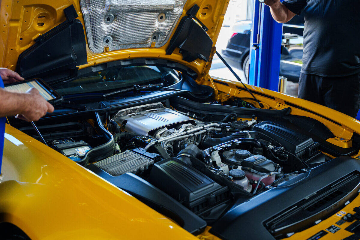 Autobahn technician checking a Mercedes-AMG engine bay on a tablet