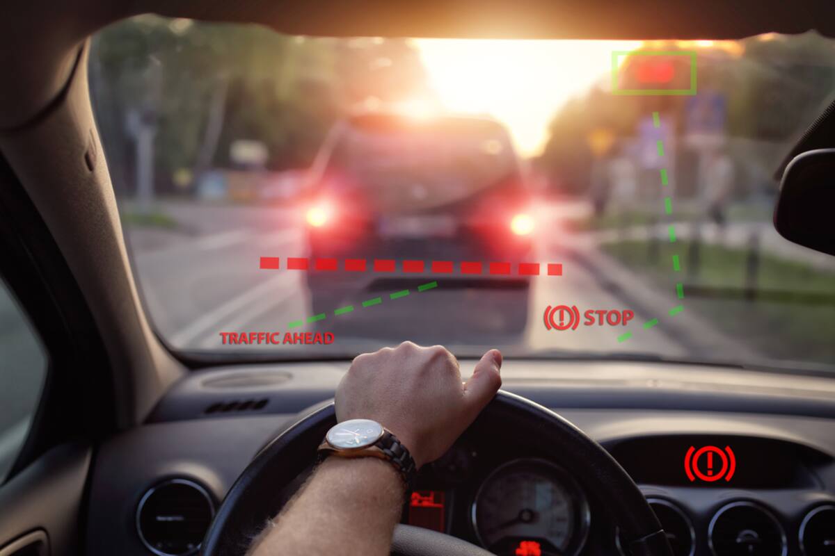 View through a windshield of brake lights ahead with a head-up display