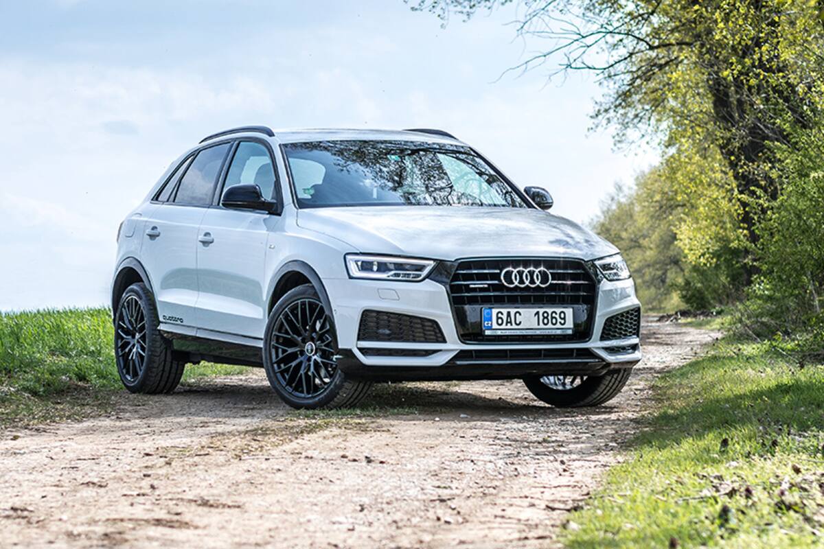 White Audi SUV parked on a track