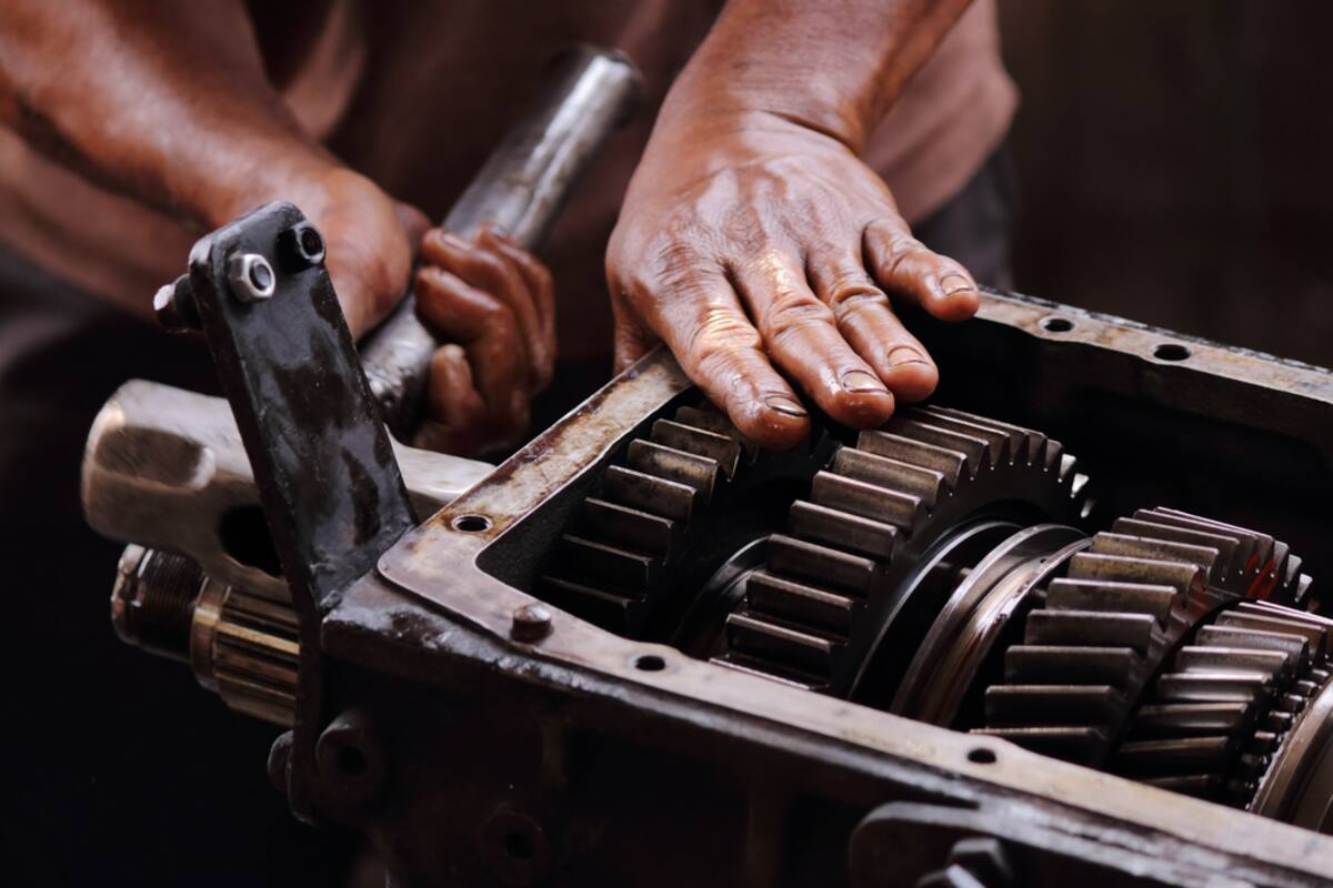 Disassembled transmission gears on a bench