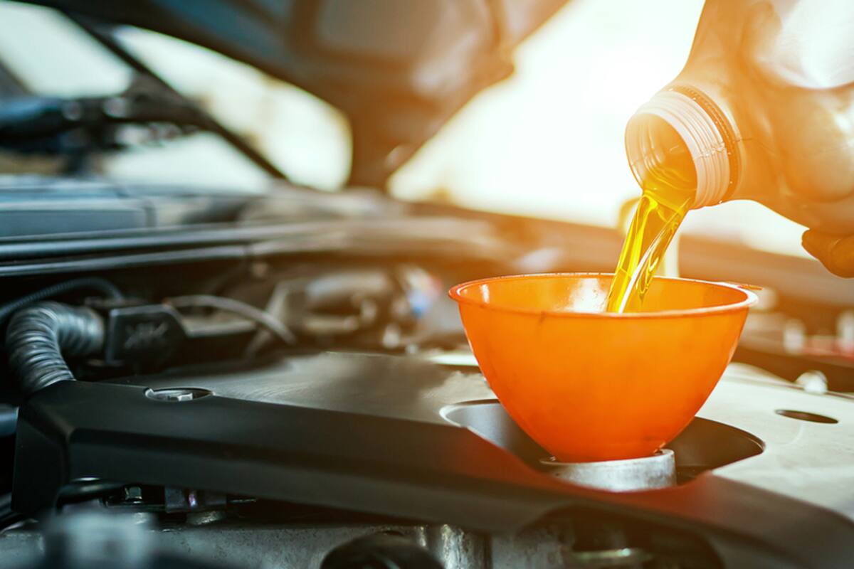 Fresh oil being poured through a funnel