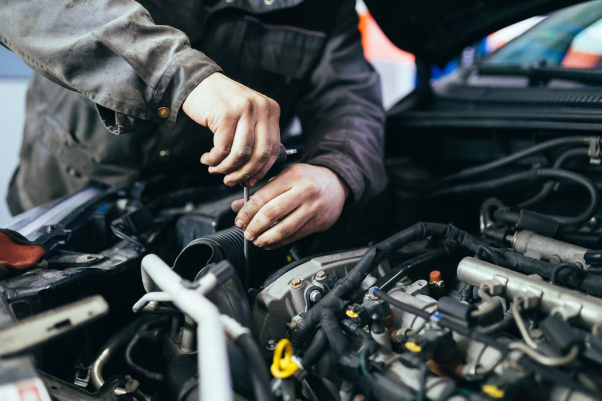 Technician working on an engine