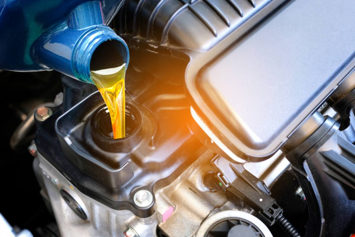 Engine oil being poured into an engine