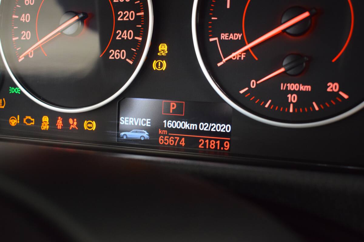 BMW instrument cluster showing a service message