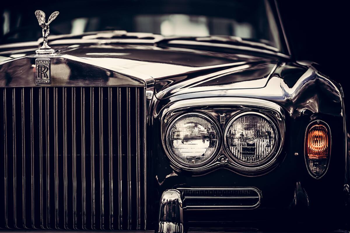 Front of a Rolls-Royce with its hood ornament