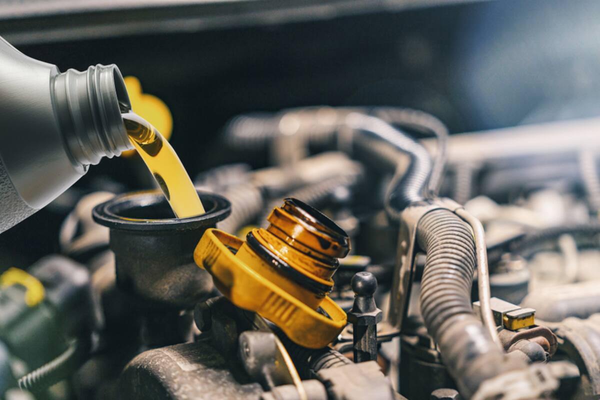Synthetic oil being poured into an engine