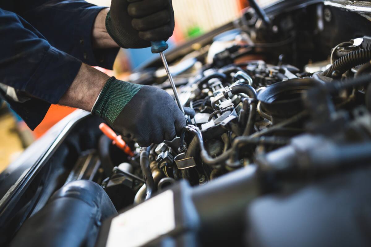 Technician working on an engine