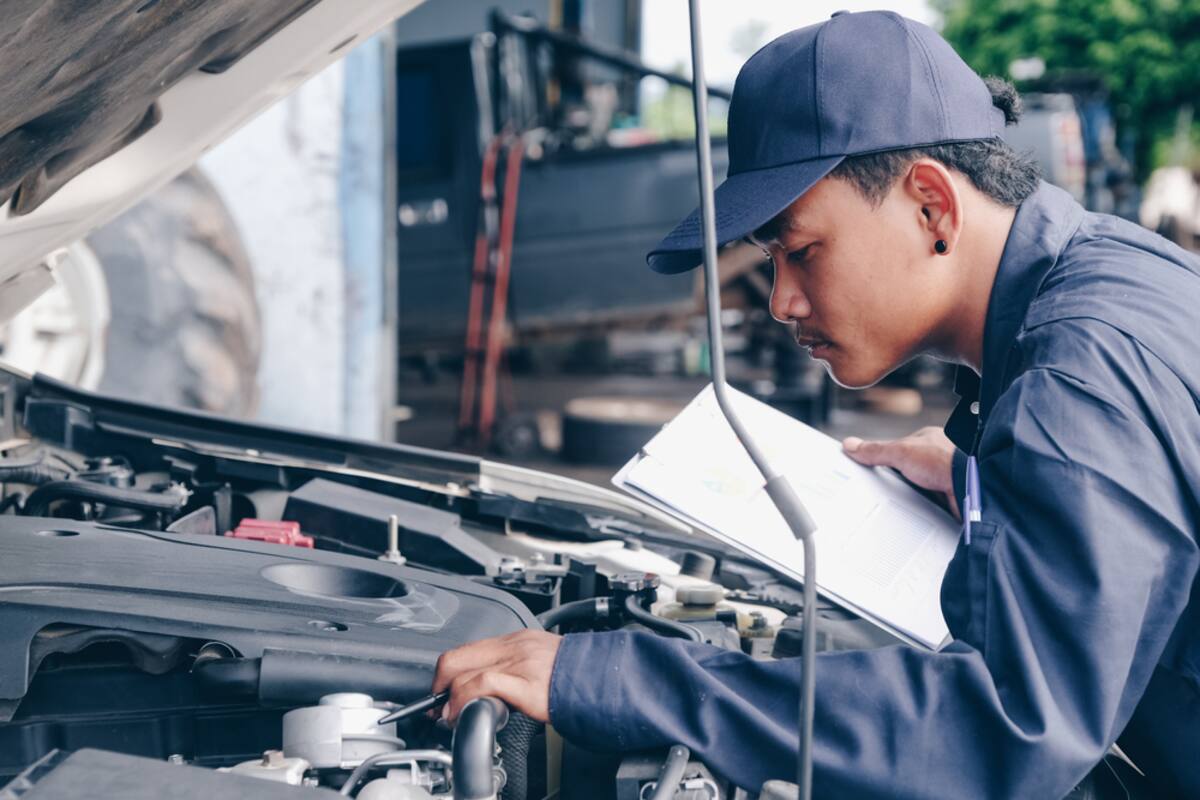 Technician carrying out an inspection with a clipboard