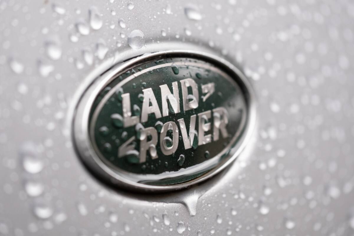 Land Rover badge covered in water droplets