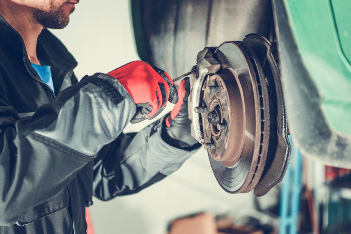 Technician servicing a brake disc