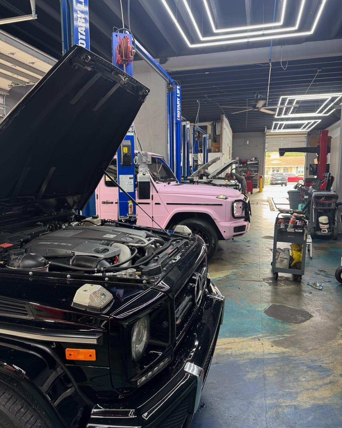 A black Mercedes-Benz G-Class with the hood open at Autobahn Auto Center