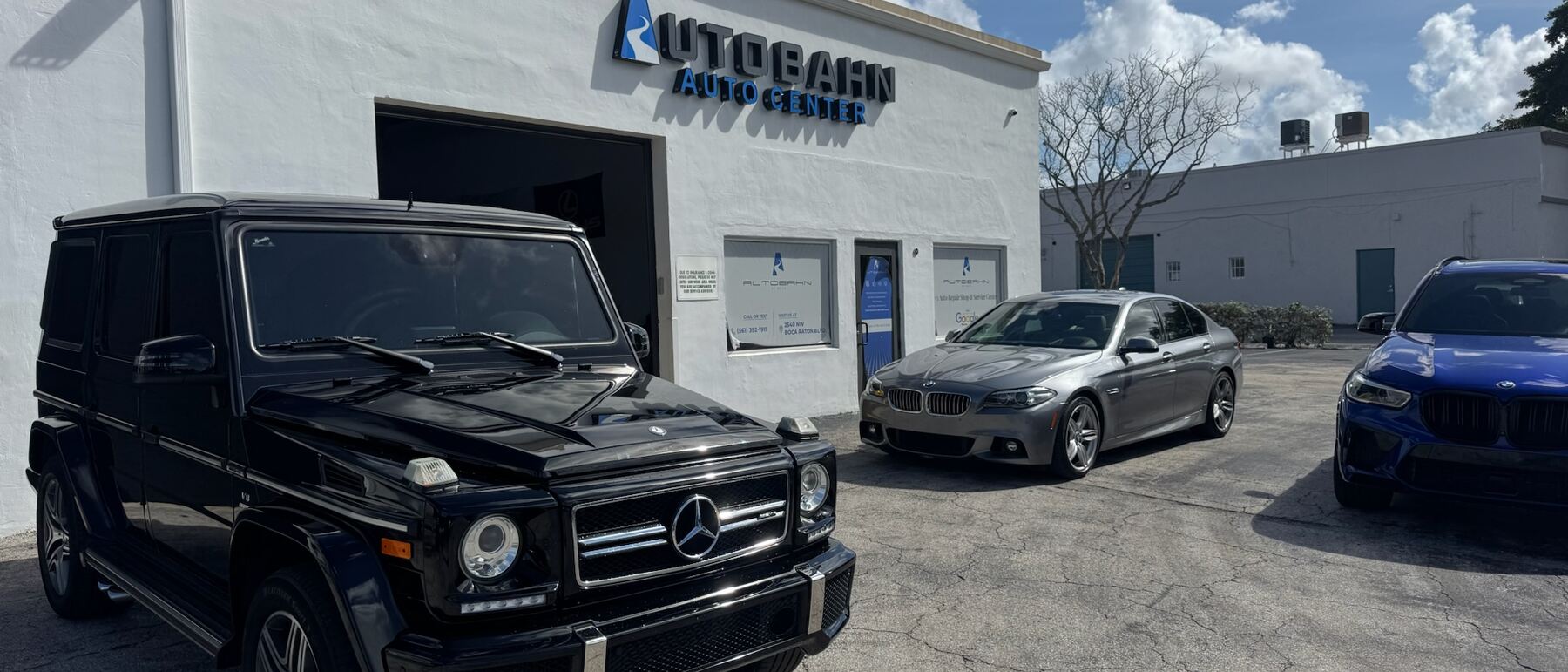 A black Mercedes-Benz G-Class parked outside Autobahn Auto Center