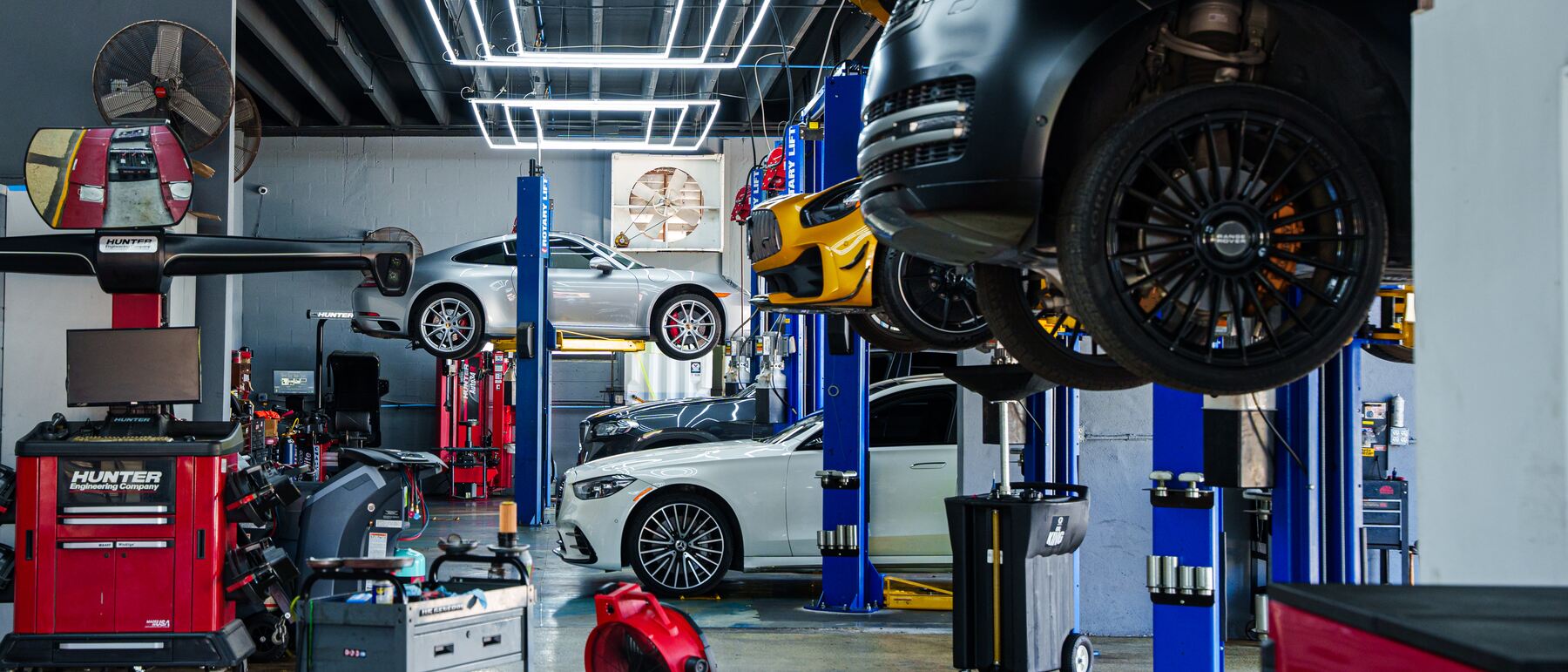 The Autobahn Auto Center service bay with a Range Rover on the lift