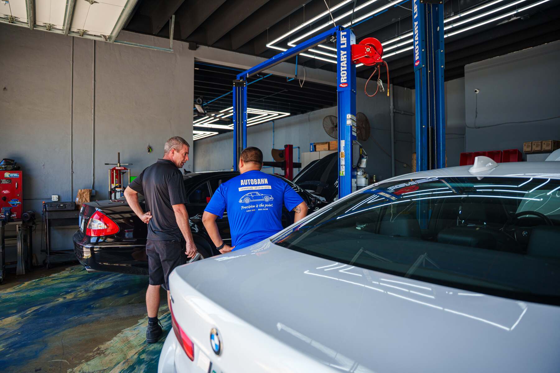 Autobahn technicians working on a car in the shop