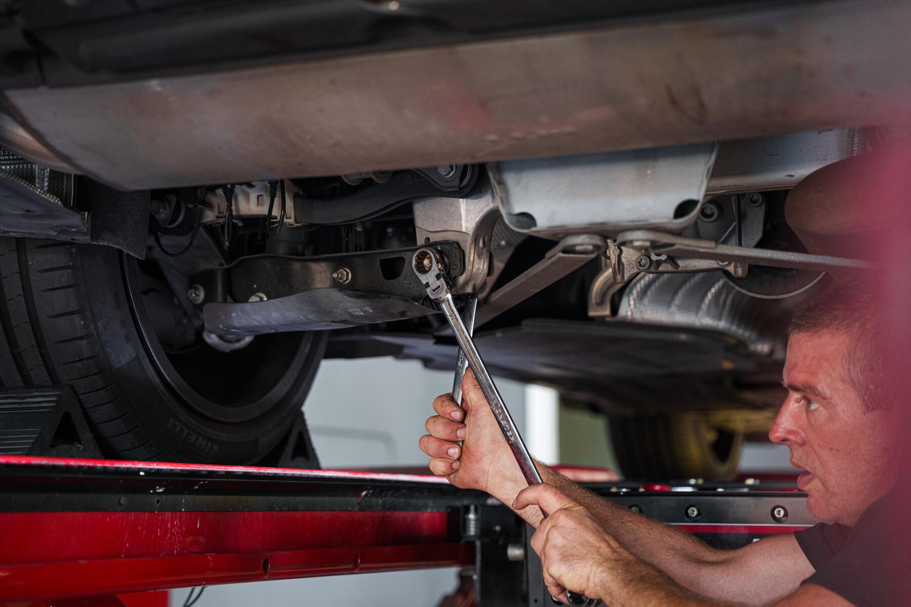 Underbody and driveline work on a raised vehicle at Autobahn Auto Center